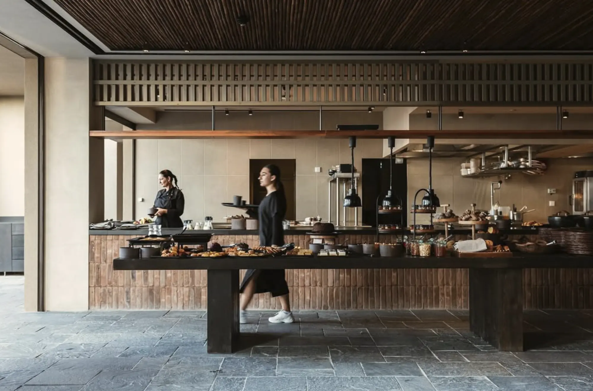 Breakfast buffet in front of an open kitchen